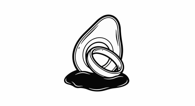 A halved fruit with two rings resting on a dark puddle