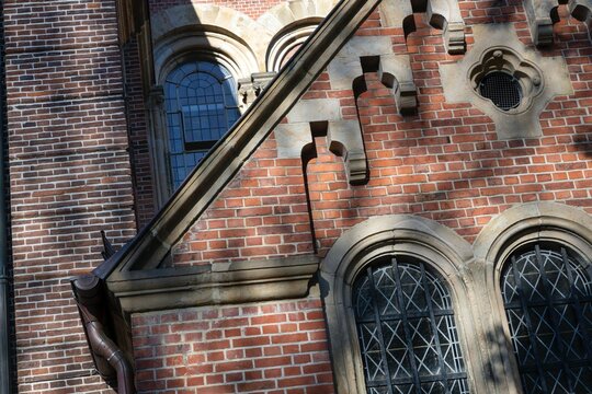 Scenes at the centre of the town of Lingen Germany. Brick facade detail of a church.