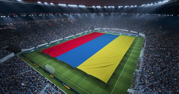 Professional Stadium Soccer Game Championship With Flag of Armenia Spread Across the Pitch Before Football Match Start. Cheering Crowds of Fans Surround the Field. Aerial Elevated Static Wide Shot