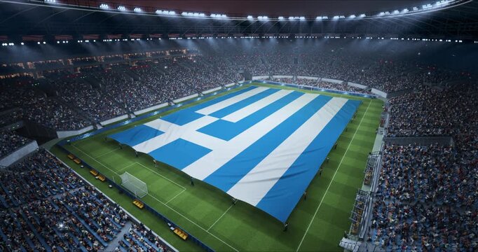 Professional Stadium Soccer Game Championship With Flag of Greece Spread Across the Pitch Before Football Match Start. Cheering Crowds of Fans Surround the Field. Aerial Elevated Static Wide Shot.