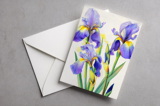 Mockup white greeting card and envelope with iris flowers and light background 
