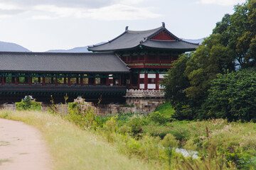 Fototapeta premium Woljeonggyo Bridge, Gyeongju, South Korea, in a autumn fall day with a blue sky, covered bridge, Silla Dynasty Pavilion, North Gyeongsang Province, Silla dinasty traditional Korean architecture