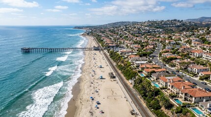 Fototapeta premium Aerial view of San Clemente Beach with neighborhoods in the background, Southern California coastal lifestyle, sandy shoreline, rolling surf, residential community, realistic daylight detail, premium