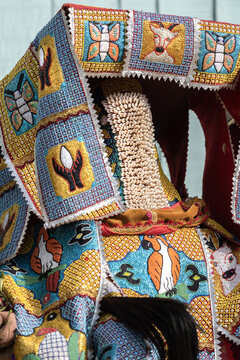 Ganvie, Benin - 14 April 2023: View of an ornate, vibrant headdress adorned with intricate embroidery and delicate beadwork, a cultural spectacle of tradition and artistry.