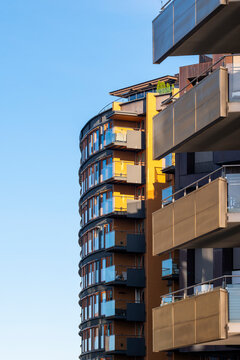 Modern residential architecture building with balconies in Oslo Norway featuring minimal skyline and open space on clean daylight background for design use