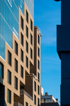 Modern architecture building facade with windows in Oslo Norway showing minimal skyline and open space on clear daylight background for designers