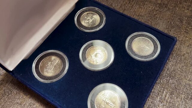 Detailed video of a 1999 United States quarter dollar collection presented inside a blue collector box with individual protective capsules.