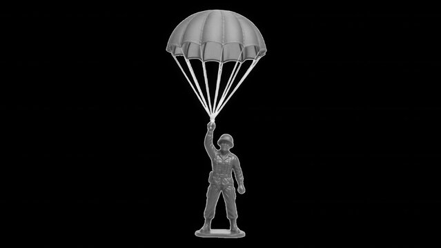 Gray toy soldier with parachute descending, isolated on a transparent background