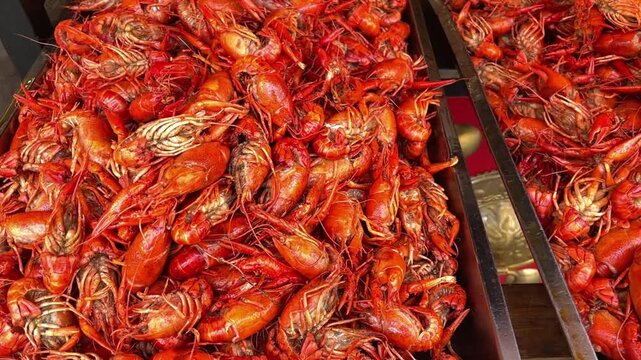 Boiled crayfish on an iron plate. Boiled red crayfish background. top view.