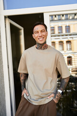 Fototapeta premium Young man enjoys a sunny day at home, showcasing his style and confidence