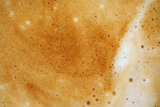 Golden abstract coffee. Modern coffee pattern design. Elegant golden coffee swirl resembling cosmic map background. Stylish abstract design with coffee and gold that evokes cosmic and modern themes.