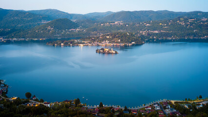 Panorama at the dusk of the Orta Lake (Piedmont, Northern Italy), seen from the top of Madonna del Sasso Sanctuary, over the western banks of the lake (UNESCO Site). © stefanopez