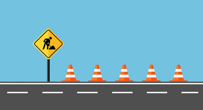 Road construction ahead sign with traffic cones on highway, safety warning