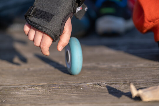 Hand Holding Inline Skate Wheel Close Up Sport Equipment Detail