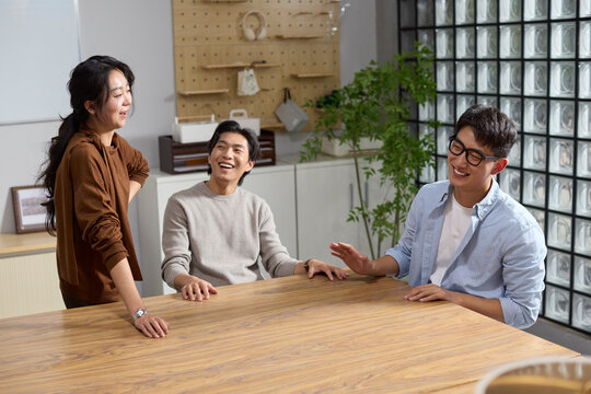 Colleagues share a light-hearted moment during a casual meeting