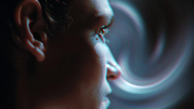Closeup profile man listening to sound, ear lit by swirling neon light trails, subtle skin texture, ambient studio background, contemplative expression,