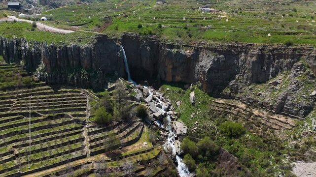Scenic aerial video of a waterfall in Faraya Lebanon surrounded by cliffs and natural beauty
