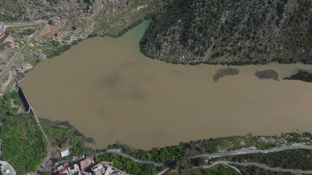 Drone shot capturing the dam of Oyoun El Samak in Akkar with wide water view and scenic mountain background