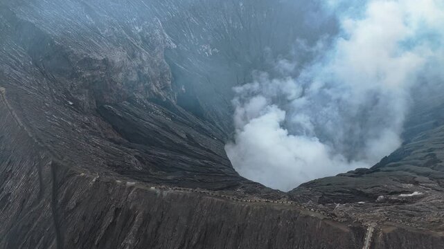 Aerial view of mount bromo volcano emitting smoke