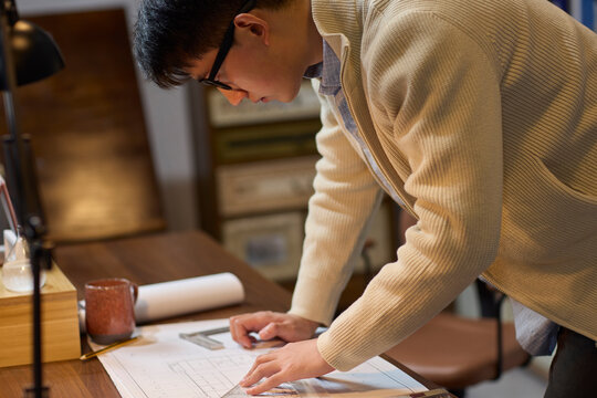 Businessman works late into the evening to meet a deadline