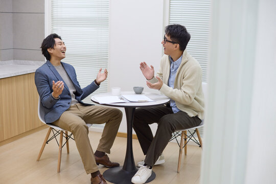 Colleagues in discussion at the coffee table