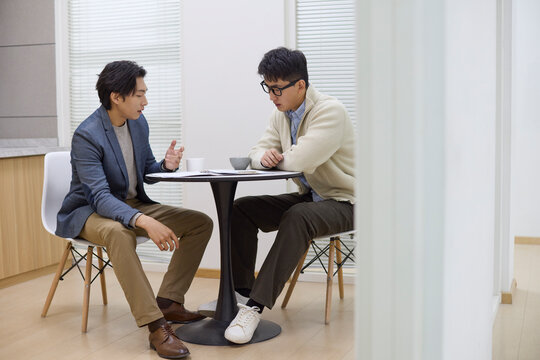 Colleagues in discussion at the coffee table
