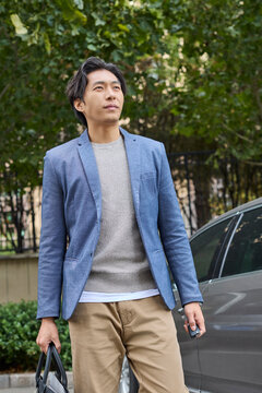 A businessman arrives at his destination by car