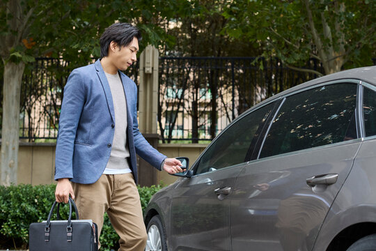 A businessman arrives at his destination by car