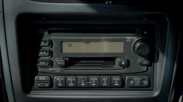 Inserting a CD Into the Factory Retro CD Cassette Radio Deck Mounted on the Car Dashboard, Playing It, and Then Pressing the Eject Button to Remove It  |  Japan