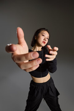 A young woman with cool confidence and chic style