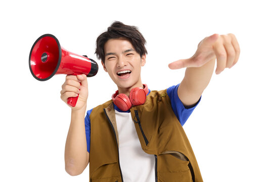 Excited young man shouting into a megaphone