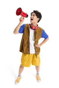 Excited young man shouting into a megaphone