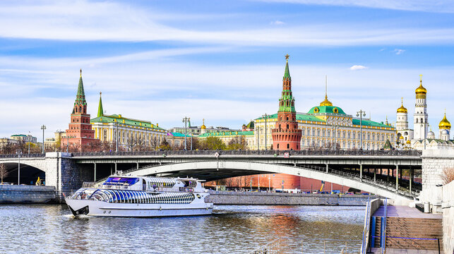 Moscow Kremlin panoramic view and tourist boat floats on River