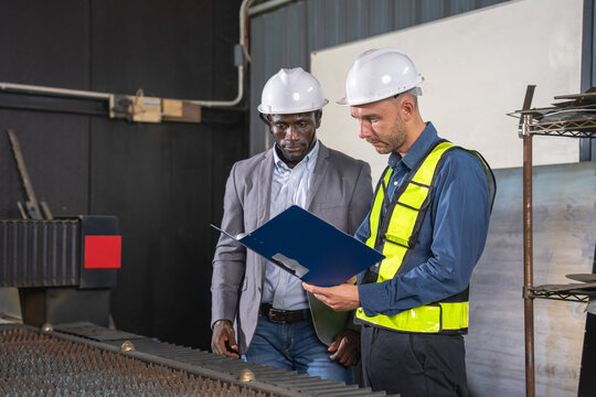 Safety meeting between engineers and management at industrial facility technical review professional environment collaborative concept