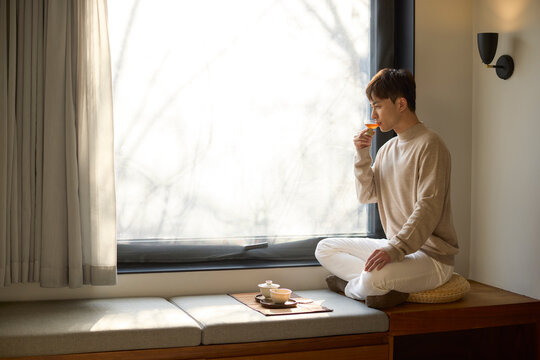 Young man enjoying a quiet cup of tea