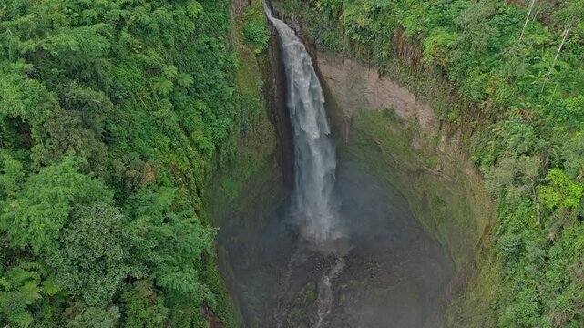 Aerial view of kabut pelangi waterfall in indonesian jungle