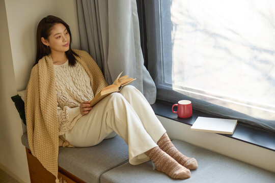 Cozy afternoon with a book and hot drink