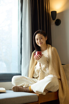 Cozy afternoon with a book and hot drink