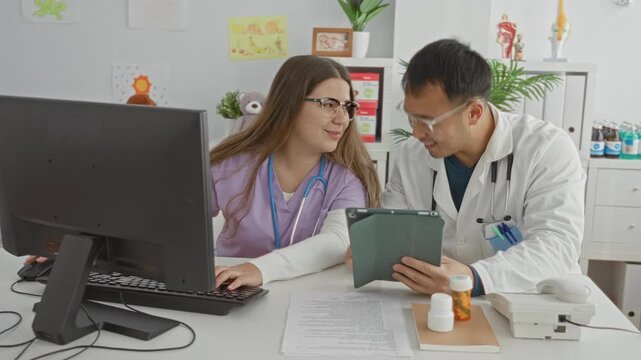 Doctor man and woman share a highfive over tablet and paperwork at clinic building, stethoscope visible, hands meeting above desk while smiling and laughing; teamwork empathy.