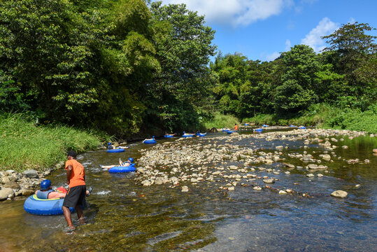 Tourists practicing river floating tubing at Bataka on the island of Dominica