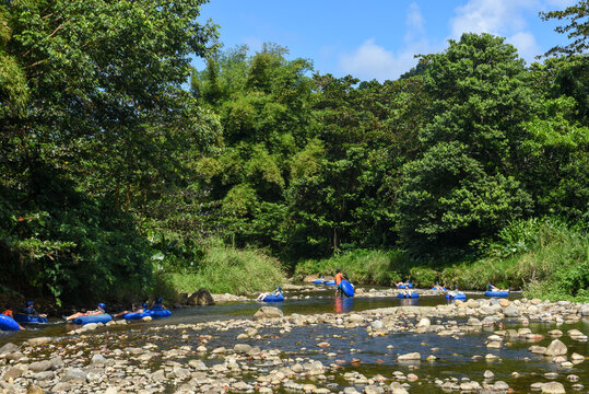 Tourists practicing river floating tubing at Bataka on the island of Dominica