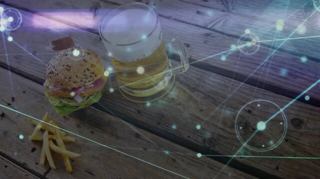 Burger, fries and beer getting network overlay activating and gliding diagonally to visualize data