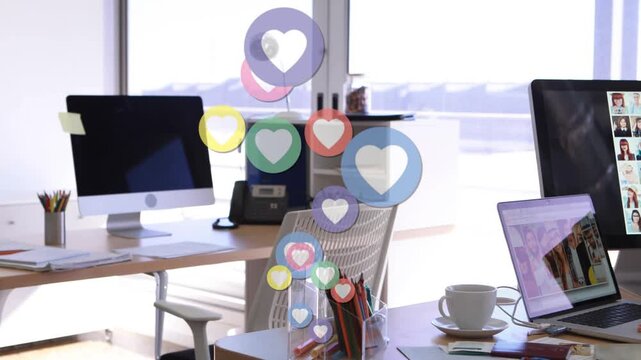 Heart icons appearing rising over monitors, woman sitting at laptop reviewing grid typing marketing