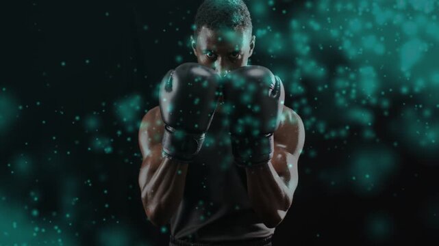 Male boxer starting with guard defending and adjusting gloves while teal particles obscuring arms