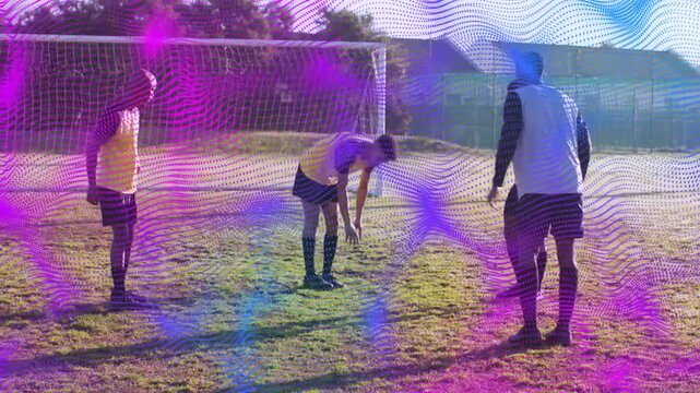 On cue three soccer players training knees and leg touches ending facing goal under purple overlay