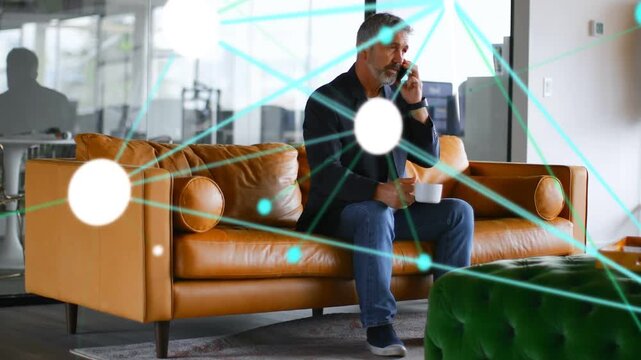 Mature man sitting holding phone and mug, business call starting teal nodes surging then fading