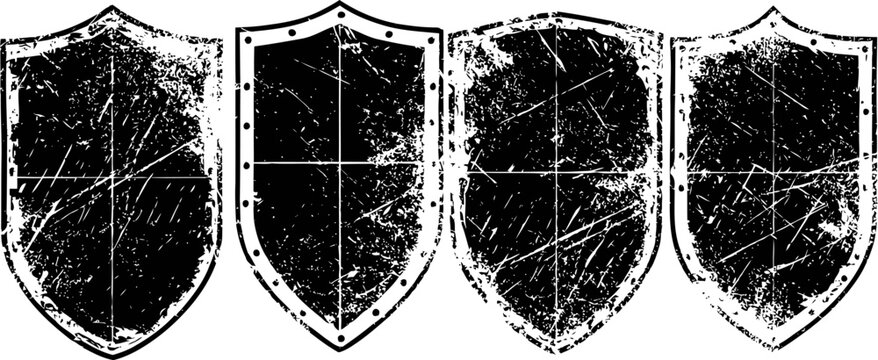 set of four vintage distressed shield silhouettes with various scratch textures and grunge effect
