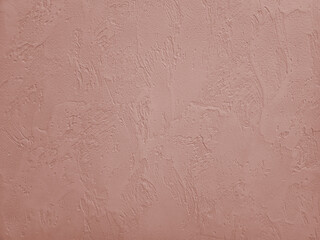 Fototapeta premium Blush pink decorative plaster wall with vertical drip relief texture, background with organic fine-grained relief pattern