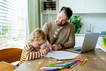 Father educating toddler about solar power and eco friendly living.