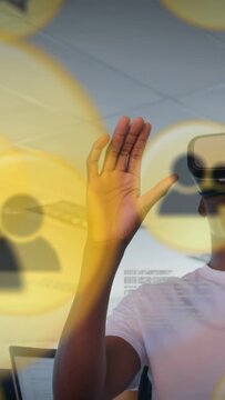 Vertical video: As icons focus, dev in VR headset raising hand pinching yellow icons to sort users